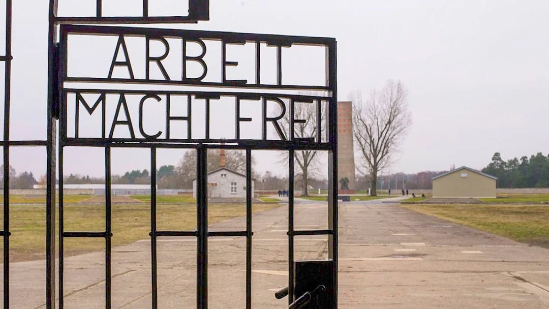 Entrance gate of Sachsenhausen Concentration Camp with "Arbeit Macht Frei" sign.