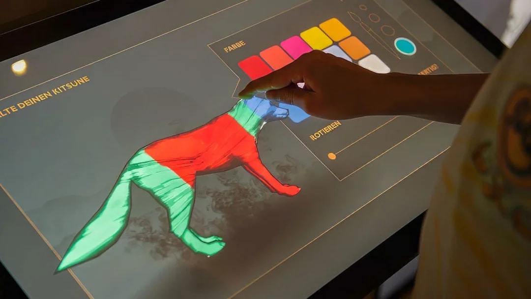 Interactive display at Samurai Museum for designing a kitsune with color options.