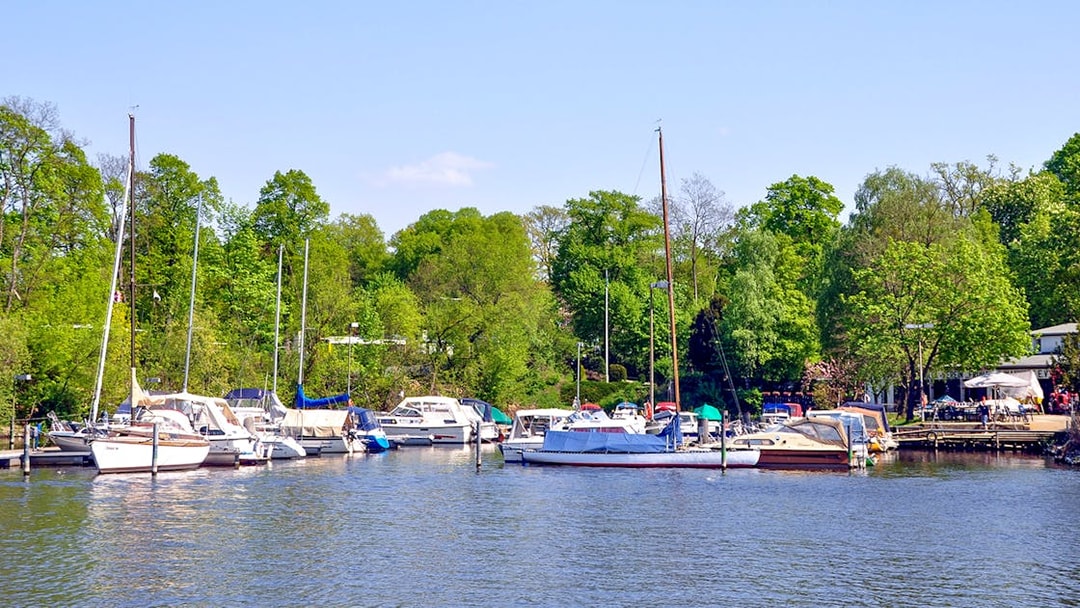 Boats docked at Great Wannsee lake port during Seven Lakes Tour from Berlin.