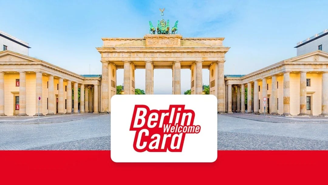 Brandenburg Gate in Berlin with Berlin WelcomeCard logo.