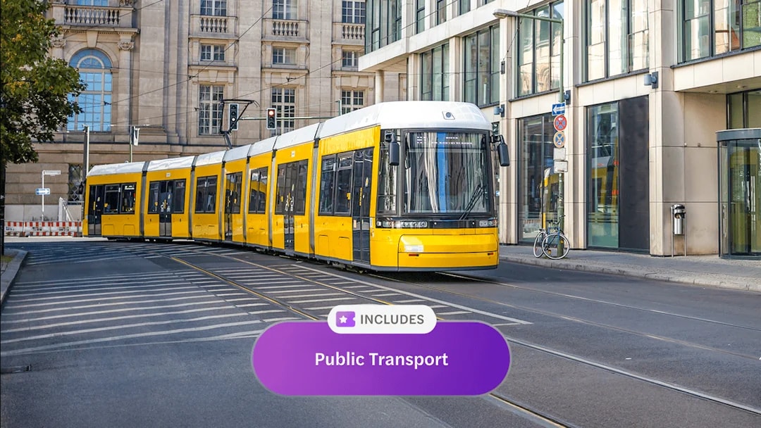 Yellow tram on Berlin street, part of Berlin WelcomeCard public transport offer.