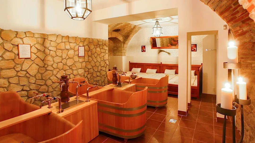 Wooden tubs and stone walls inside Bernard Beer Spa.
