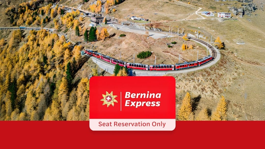 Bernina Express train winding through autumn landscape near Tirano and St. Moritz.