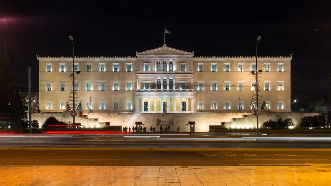 Greek Parliament building illuminated at night, Athens, Greece.
