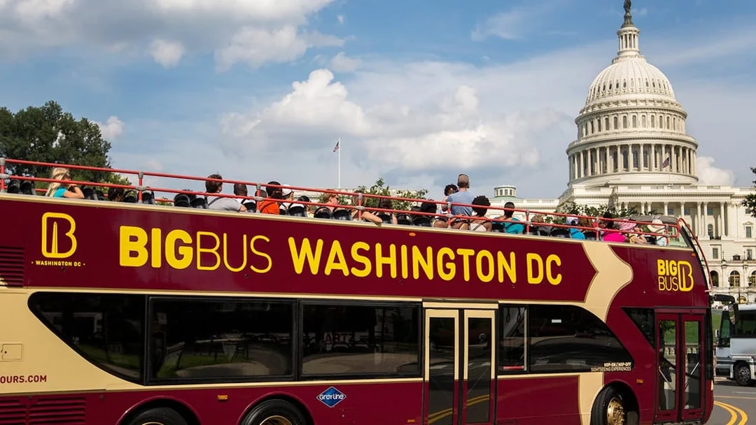 Big Bus tour in Washington DC passing by the US Capitol building.