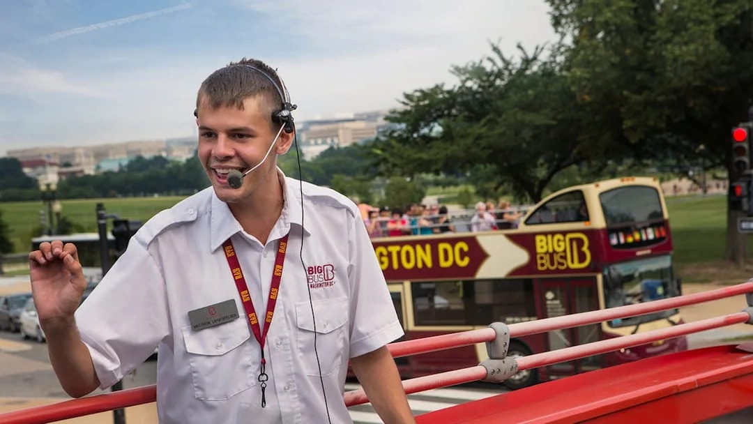 Tour guide speaking on a Big Bus Tours double-decker in Washington, D.C.