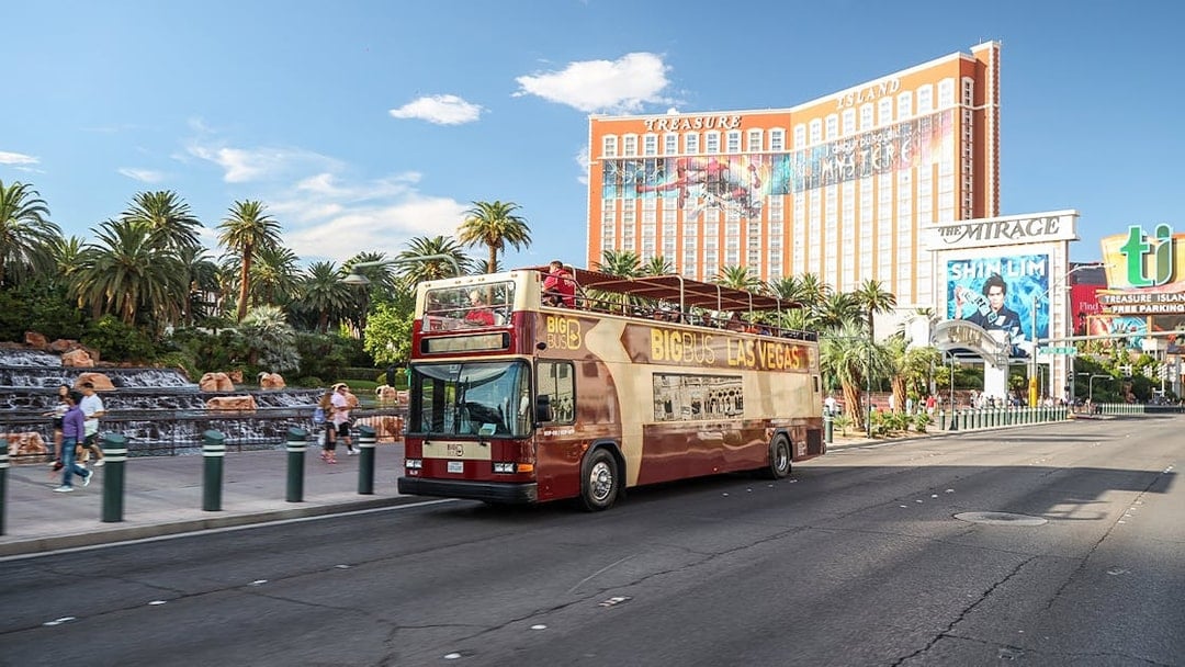 Open-top tour bus in front of Treasure Island Hotel, Las Vegas.