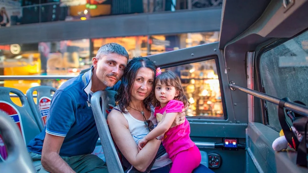 Family enjoying Big Bus Miami Panoramic Night Tour.