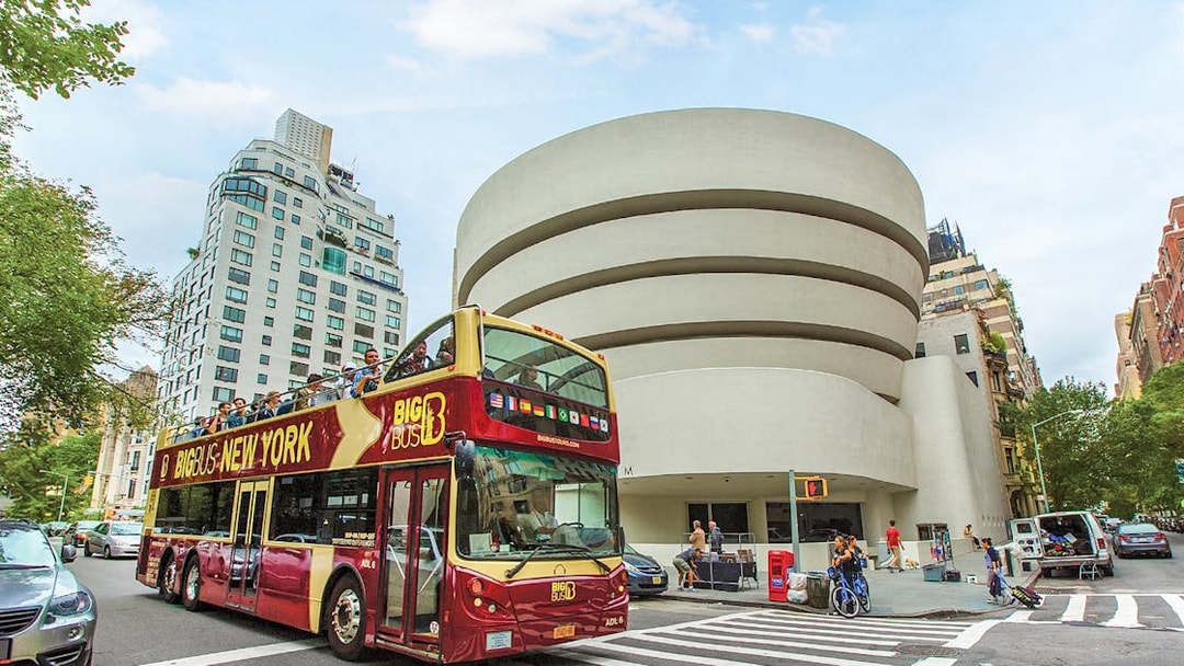 Big Bus tour passing the Guggenheim Museum in New York City.