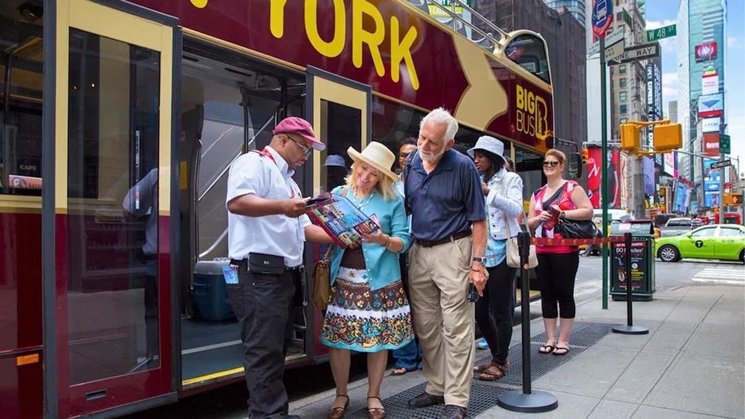 Tourists boarding Big Bus HOHO Tour at Times Square, New York.