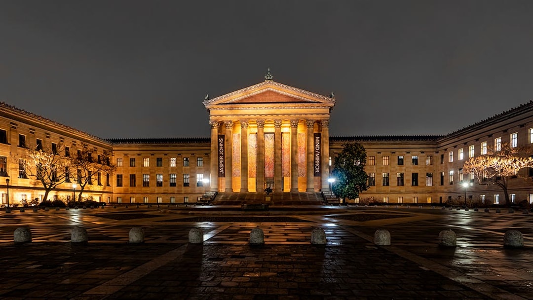 Philadelphia Museum of Art illuminated at night during a city tour.