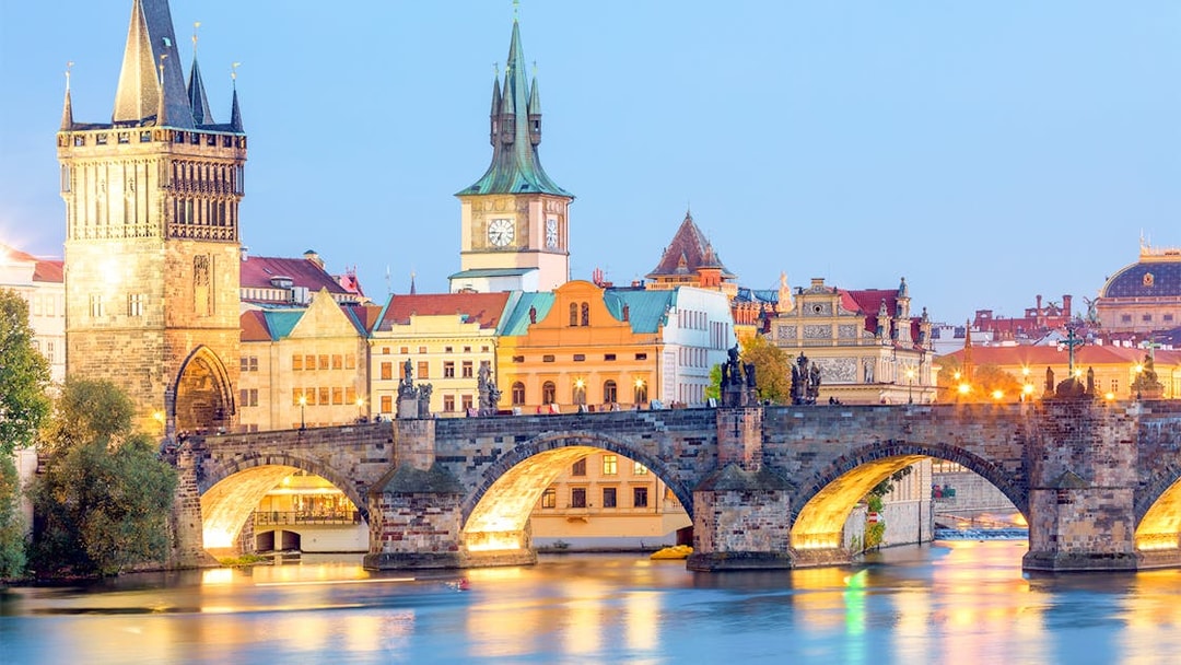 Charles Bridge over Vltava River at dusk, Prague.
