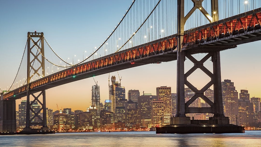 Bay Bridge at sunset with San Francisco skyline, Big Bus 1-Hr Sunset Tour.