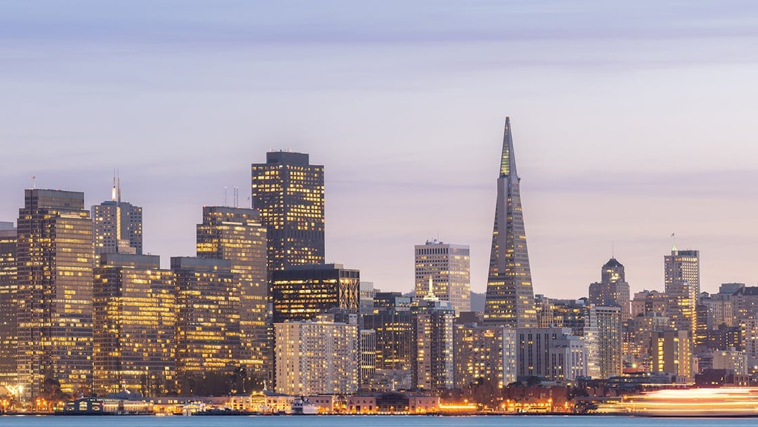 San Francisco skyline with Transamerica Pyramid at sunset during Big Bus tour.