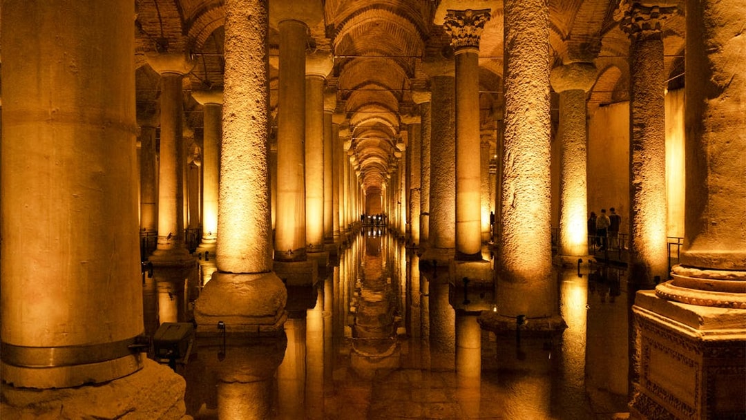 Basilica Cistern's illuminated columns and reflections in Istanbul.