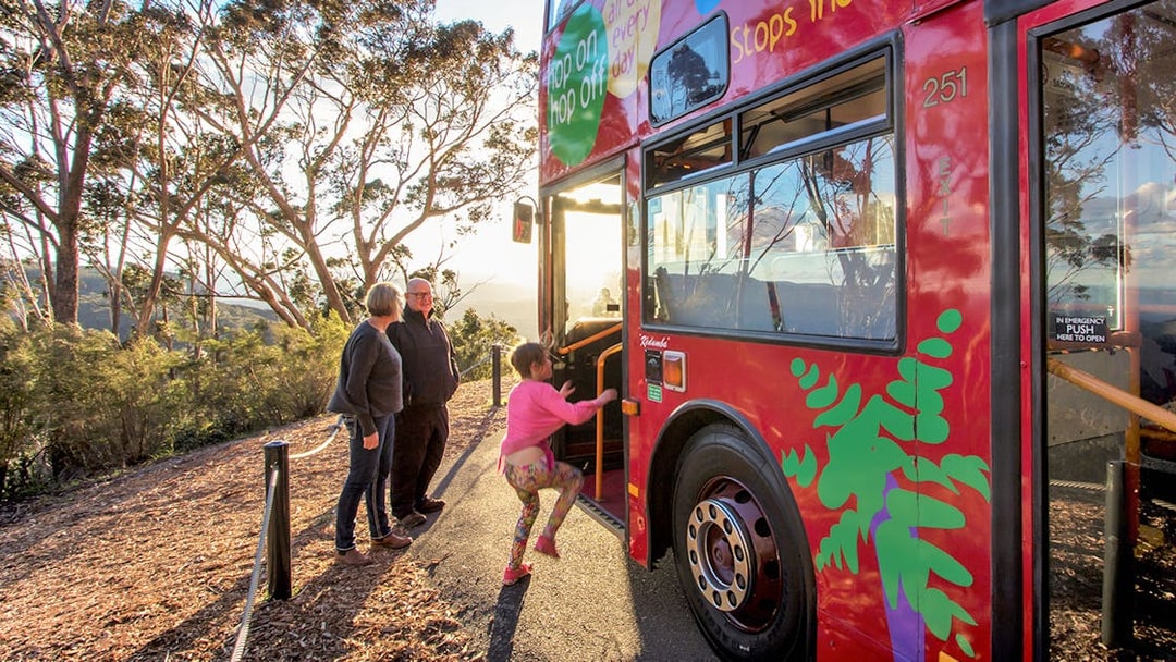 Family boarding Hop-On Hop-Off bus in Blue Mountains, Australia.