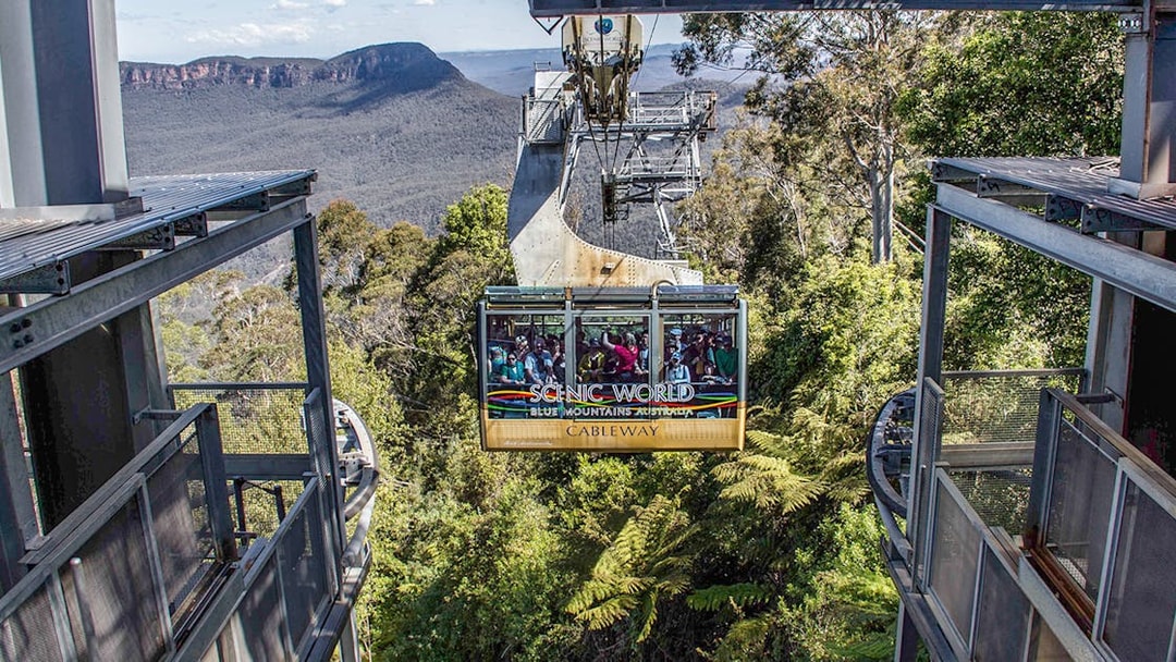 Cableway ride at Scenic World, Blue Mountains with forest and cliffs in view.