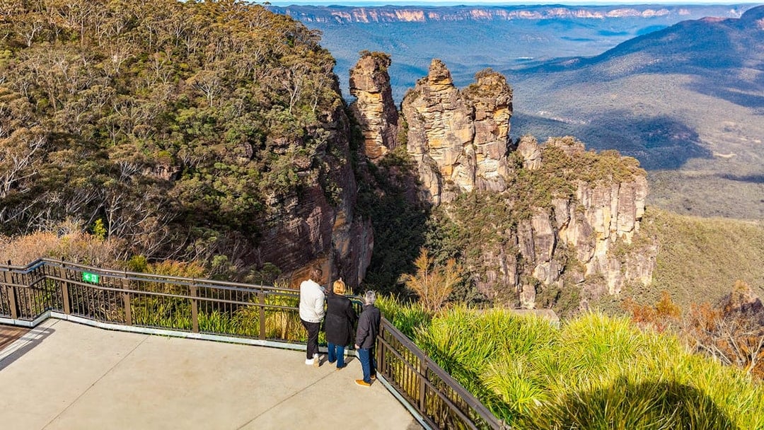 Visitors at Echo Point viewing the Three Sisters rock formation, Blue Mountains, Australia.