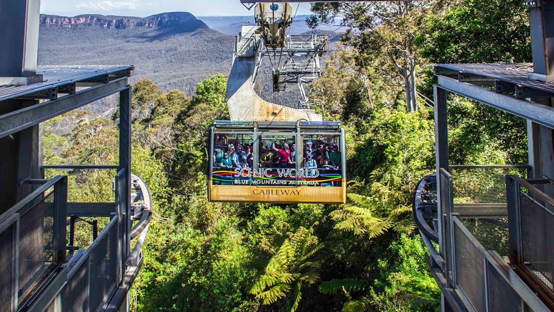Cableway ride at Scenic World, Blue Mountains with passengers and forest view.