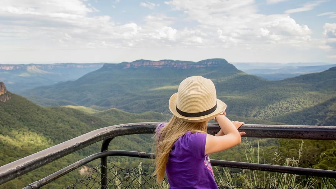 Child overlooking Jamison Valley from a viewpoint in Blue Mountains, Australia.