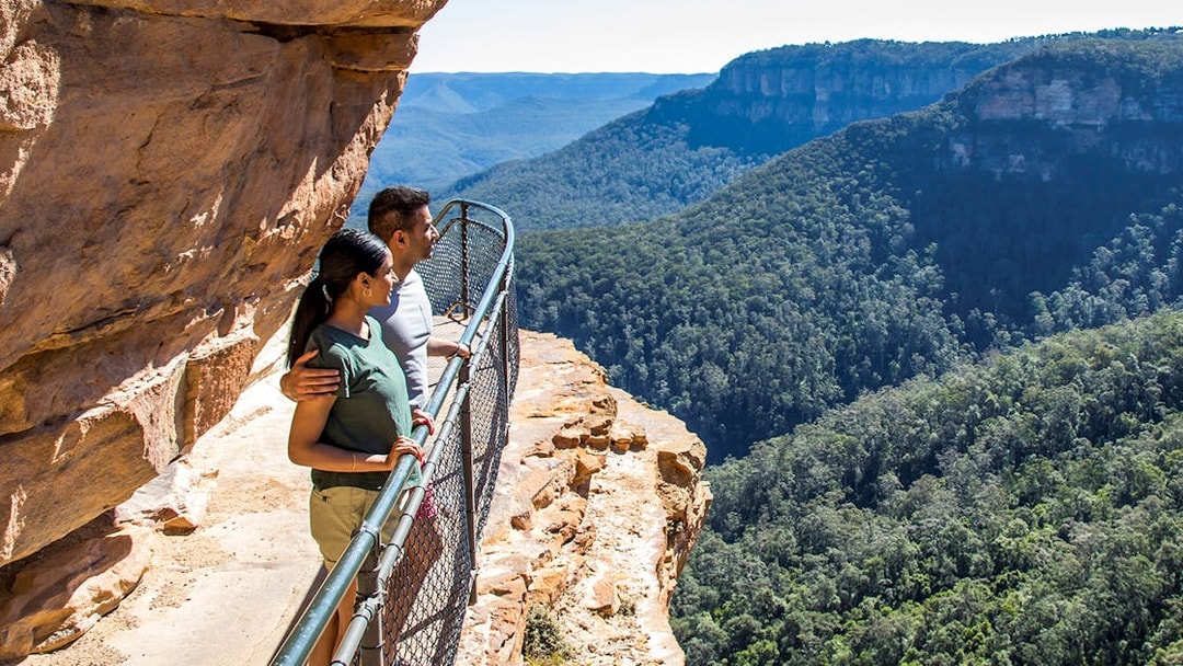 Couple enjoying Jamison Valley view on Blue Mountains day trip from Sydney.
