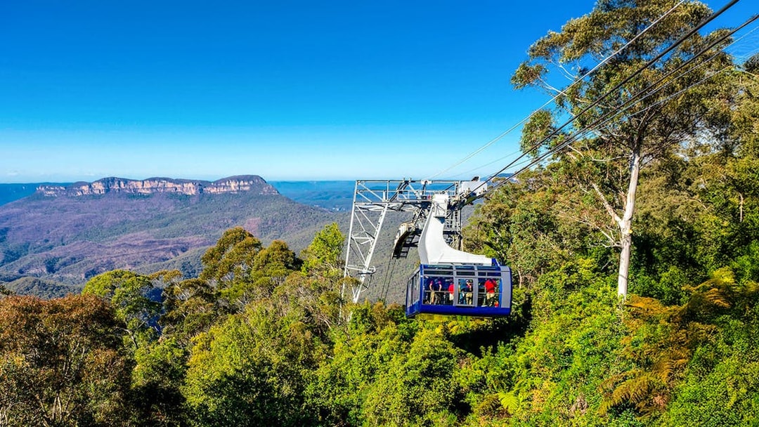 Cableway at Scenic World, Blue Mountains with passengers and forested landscape.