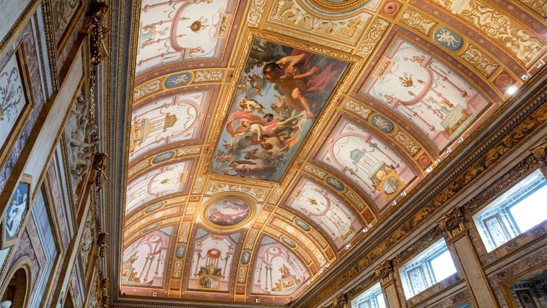Frescoes on the ceiling of Borghese Museum in Rome, depicting mythological scenes.