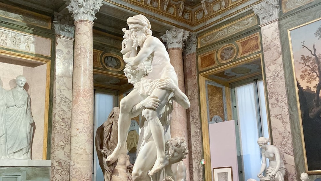 Gian Lorenzo Bernini's sculpture of Aeneas, Anchises, and Ascanius in a museum setting.