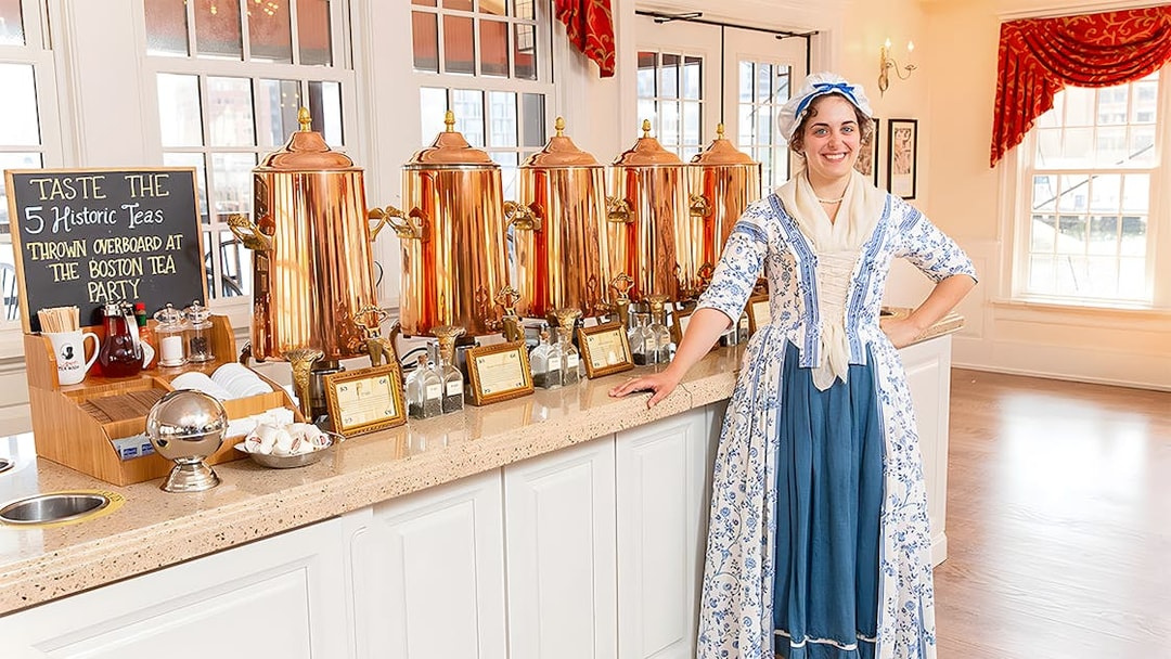 Tea tasting setup at Boston Tea Party Museum with staff in period costume.