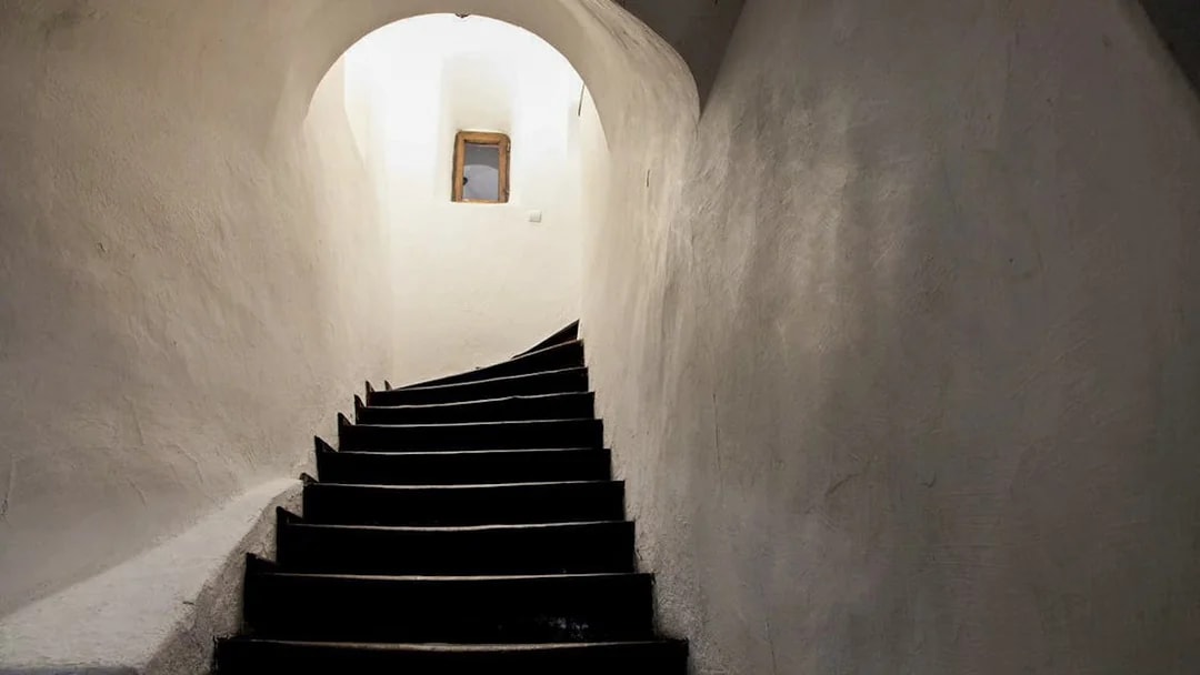 Curved staircase leading to a secret passageway inside Bran Castle, Transylvania, Romania.