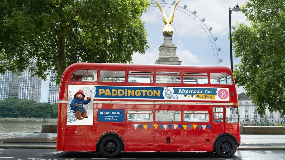 Red double-decker bus for Brigit's Bakery Paddington Afternoon Tea Tour in London.