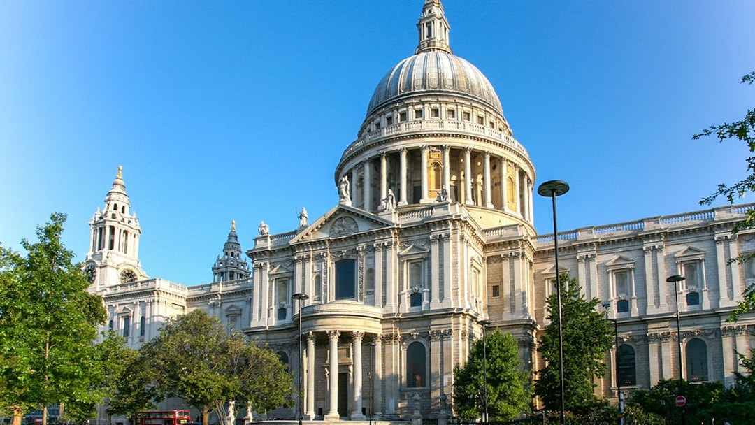 St Paul's Cathedral in London with its iconic dome and surrounding greenery.