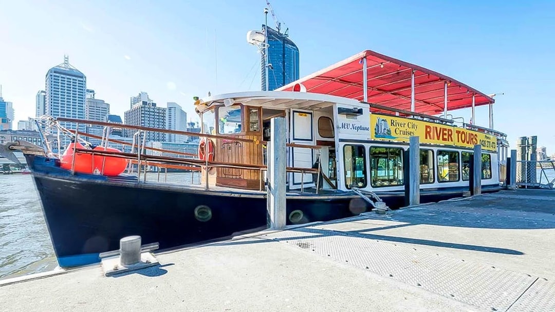 MV Neptune tour boat docked in Brisbane for River City Cruises.