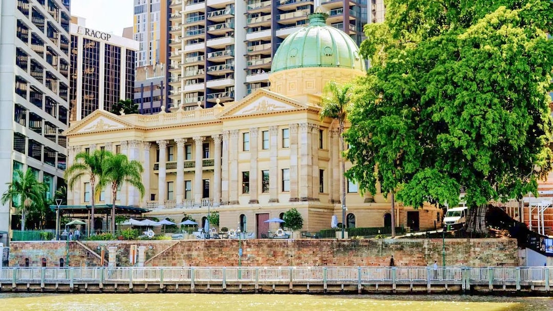 Brisbane Customs House with green dome seen from Brisbane River cruise.