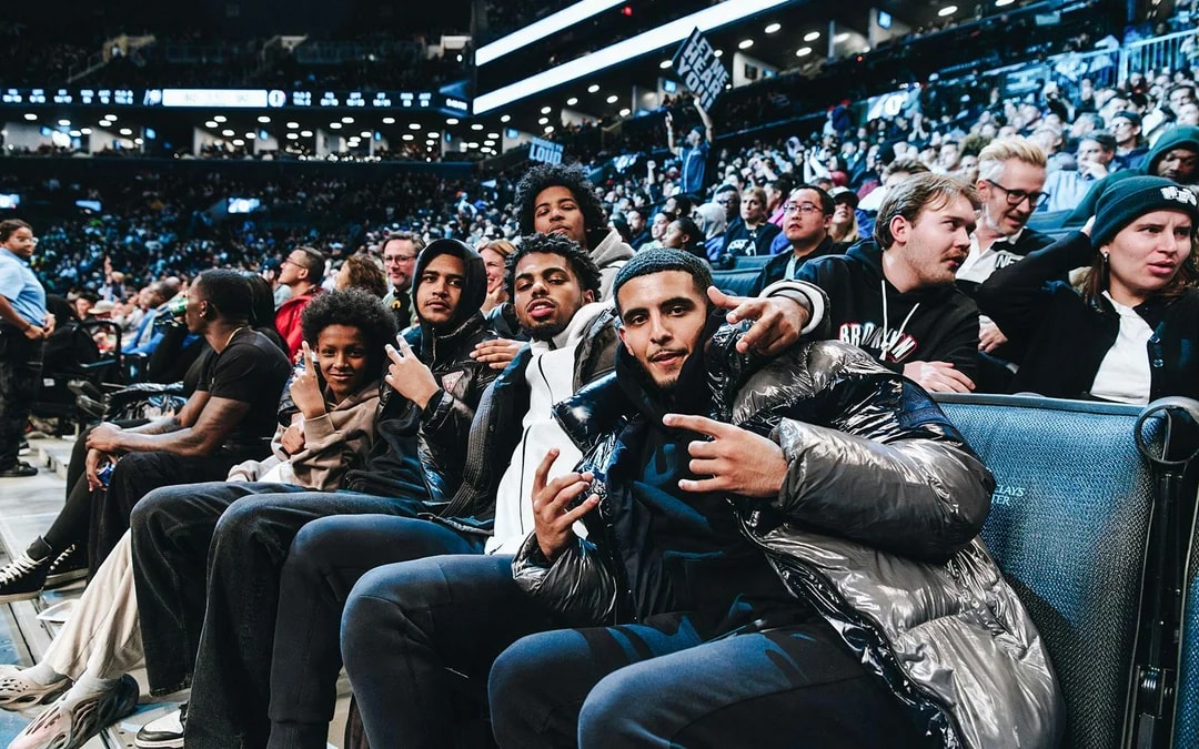 Fans enjoying a Brooklyn Nets game at Barclays Center.
