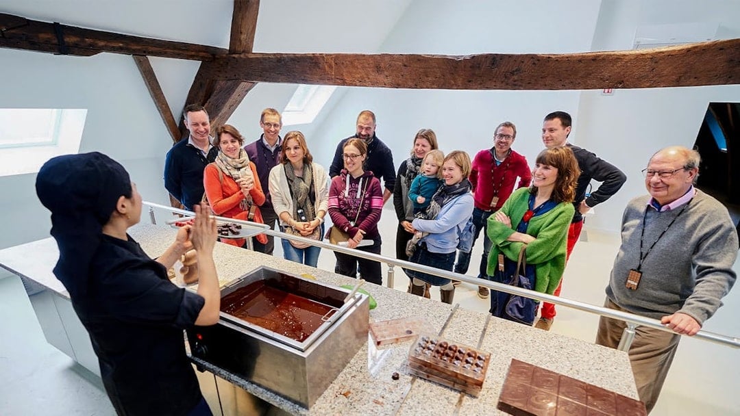 Visitors watching a chocolate-making demonstration at Choco Story Brussels.