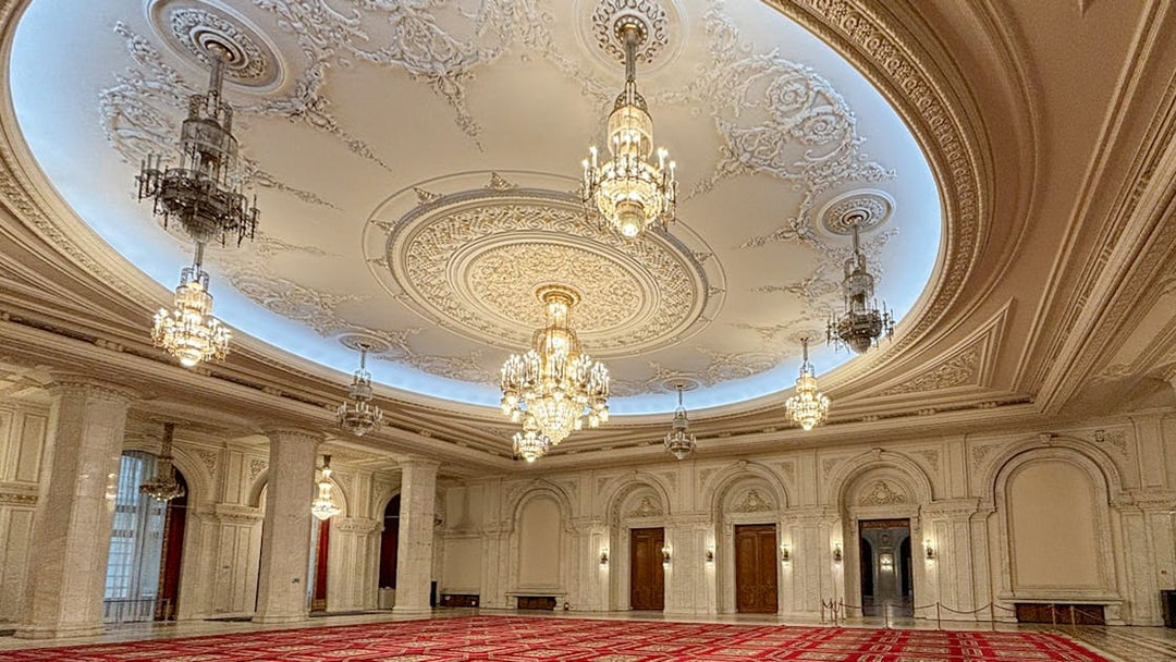 Palace of Parliament Bucharest, ornate chandeliers and detailed ceiling in Human Rights Hall.