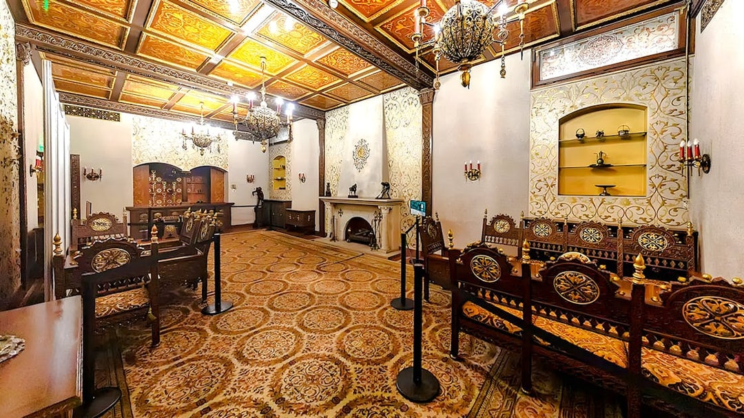 Ceaușescu Mansion interior with ornate wooden furniture and decorative ceiling, Bucharest.