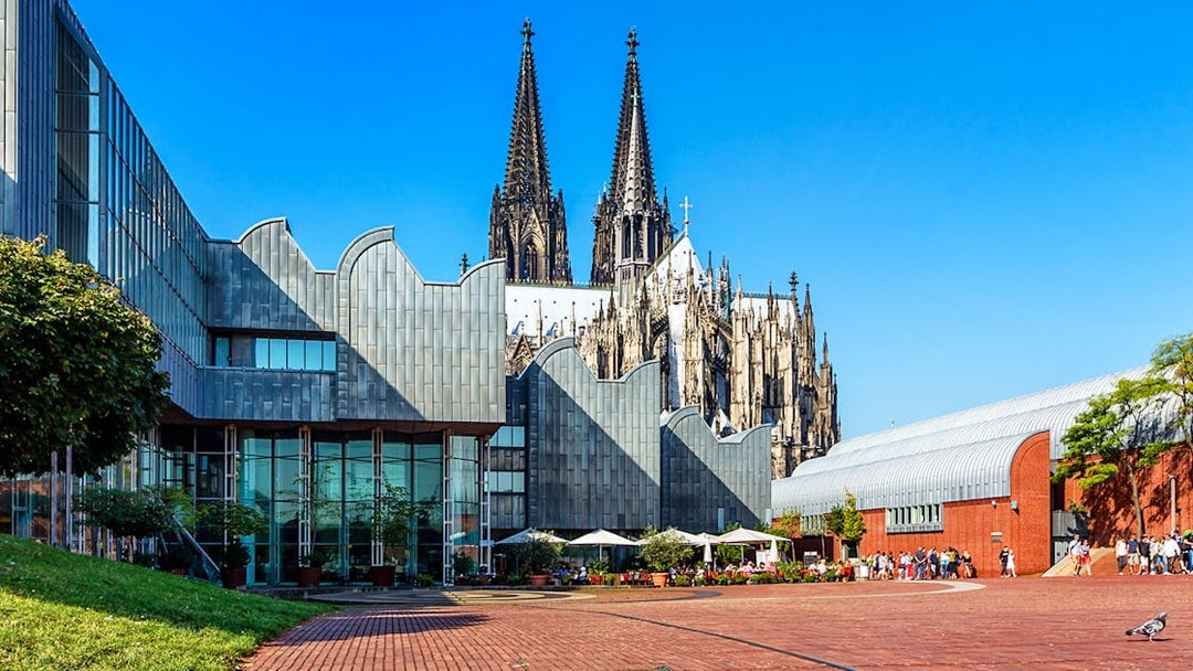 Museum Ludwig exterior with Cologne Cathedral spires in the background, Budapest City Card tour.