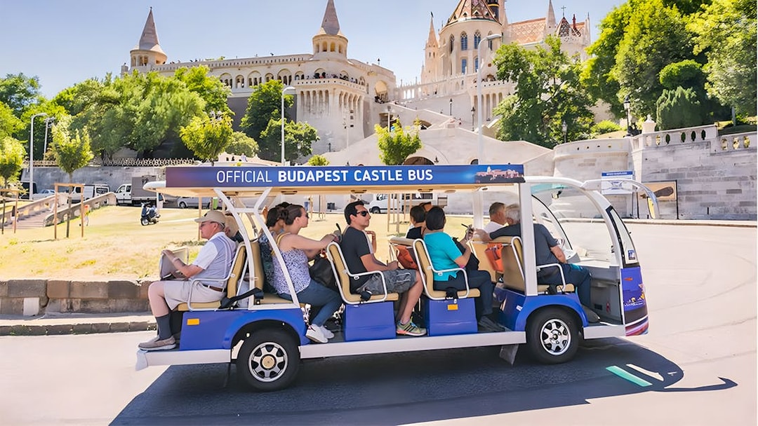Budapest Castle Bus near Fisherman's Bastion with tourists in Budapest.