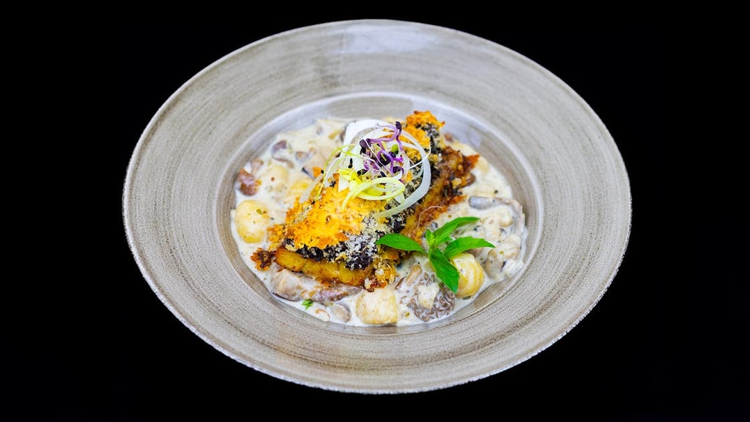 Grilled fish with creamy gnocchi served on Budapest Dinner Cruise.
