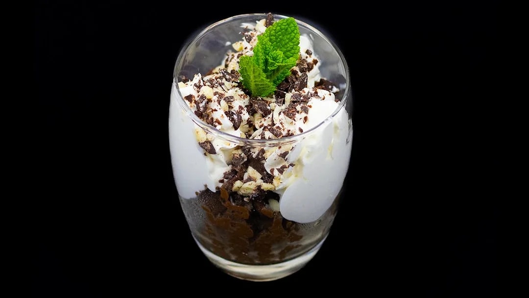 Dessert with whipped cream and chocolate shavings on Budapest Dinner Cruise.