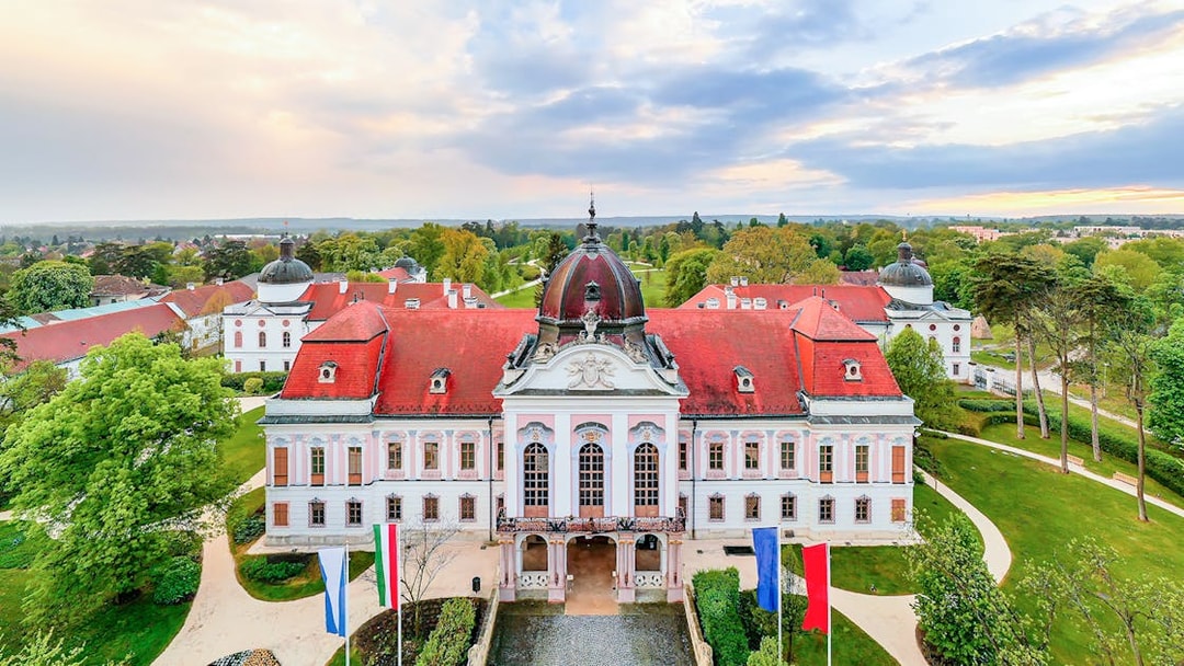 Gödöllő Palace with red roof and gardens, Budapest: Royal Sisi Guided Half-Day Tour.