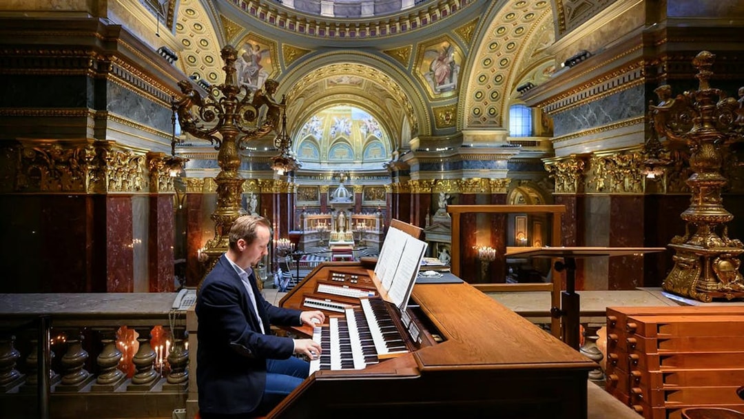 Musician playing the organ inside St. Stephen's Basilica, Budapest.