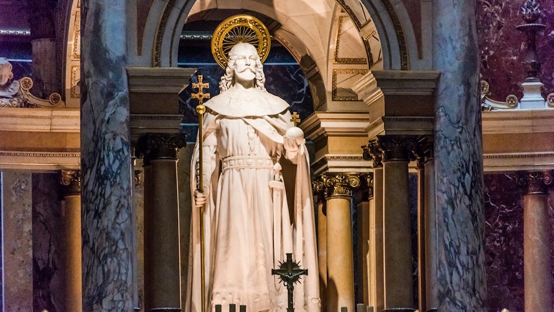 Statue at the altar of St. Stephen's Basilica, Budapest, with ornate columns.
