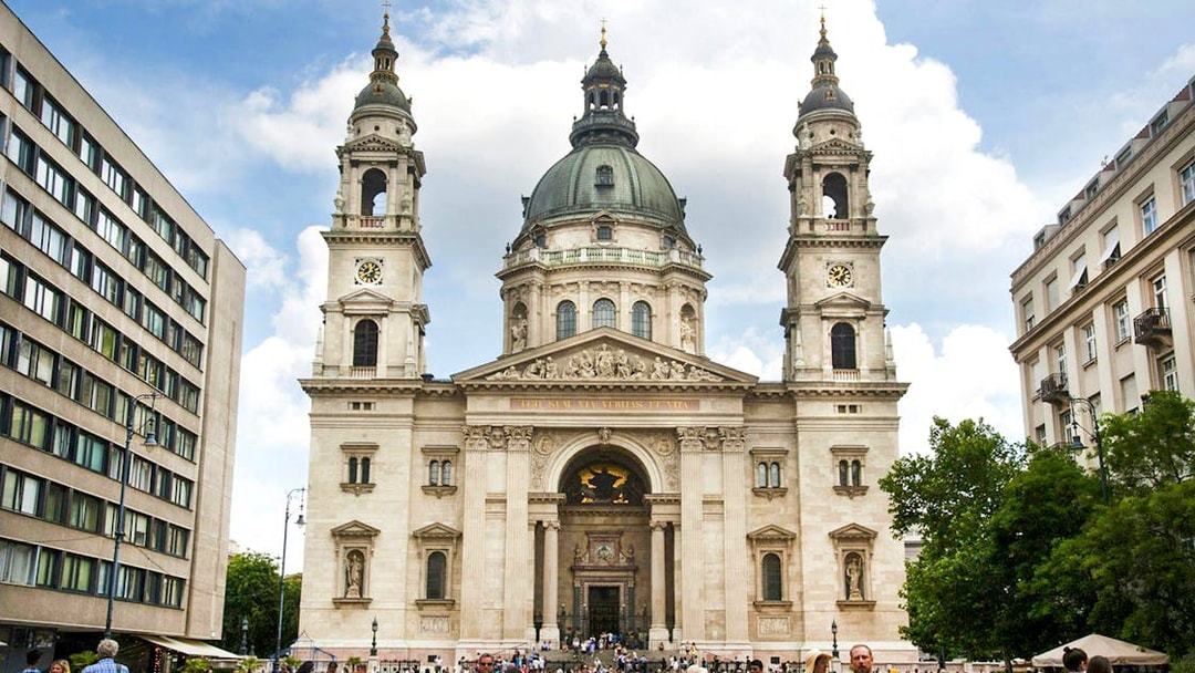 St. Stephen's Basilica exterior with a crowded entrance in Budapest.
