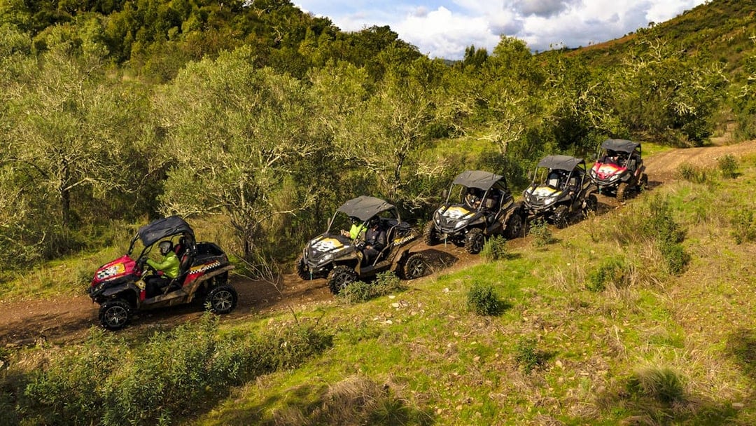 Buggies driving through a scenic trail in Algarve, Portugal.