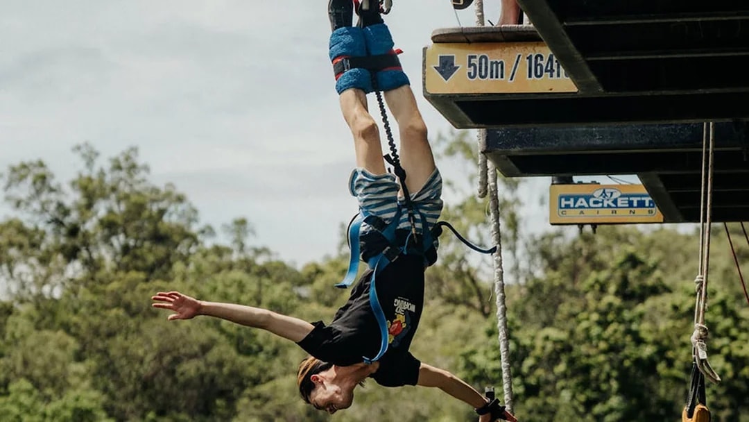 Person bungy jumping from a 50m platform in Cairns, Australia.