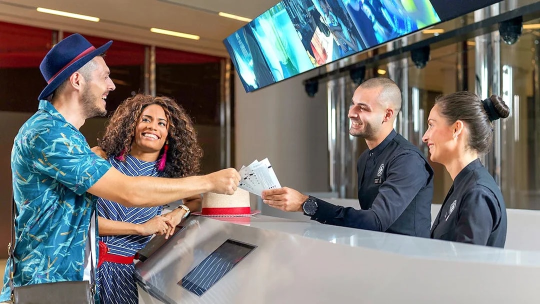 Visitors receiving tickets for Burj Khalifa's SKY level observation deck in Dubai.