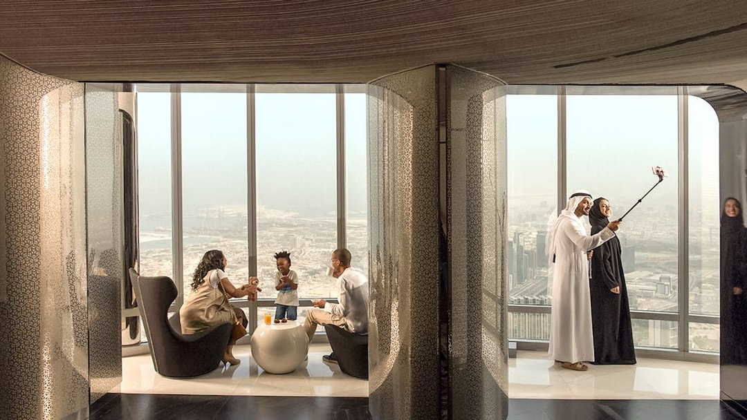 People enjoying refreshments and city view at the lounge, level 148, Burj Khalifa.